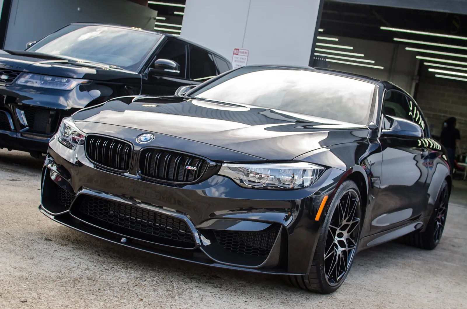 Black sports sedan after a detail