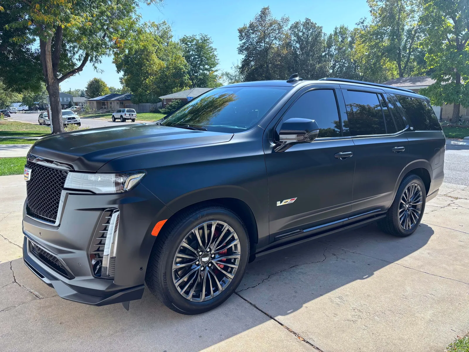 Black full-size SUV clean on a sunny street