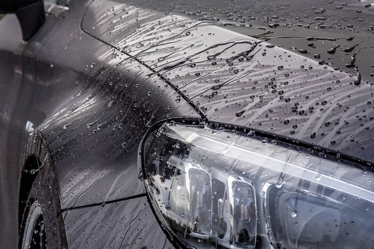 Soapy water sheeting off a headlight